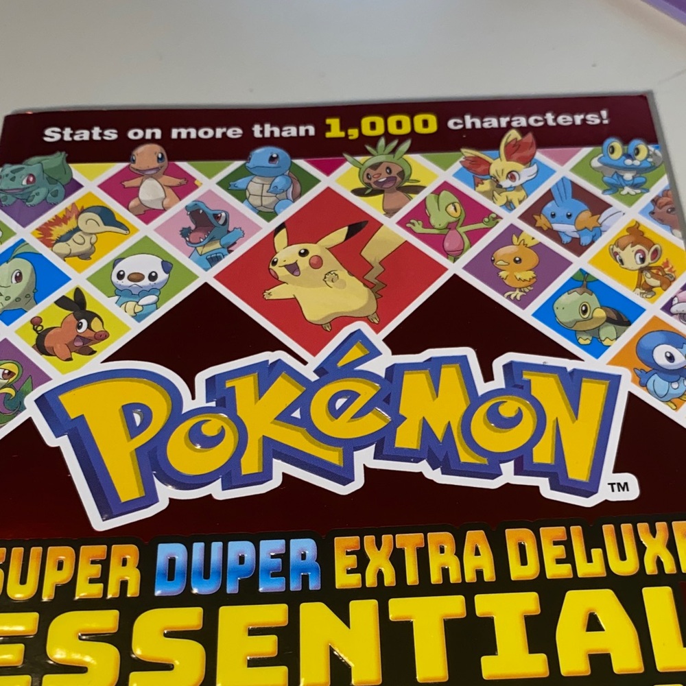Scholastic Pokémon Super Duper Extra Deluxe Essential Book - Multicolor